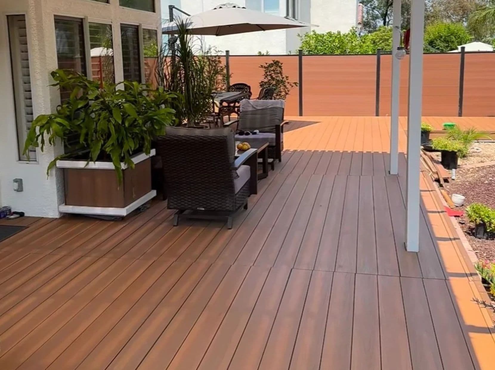 Modern outdoor deck with ASA decking in a family backyard